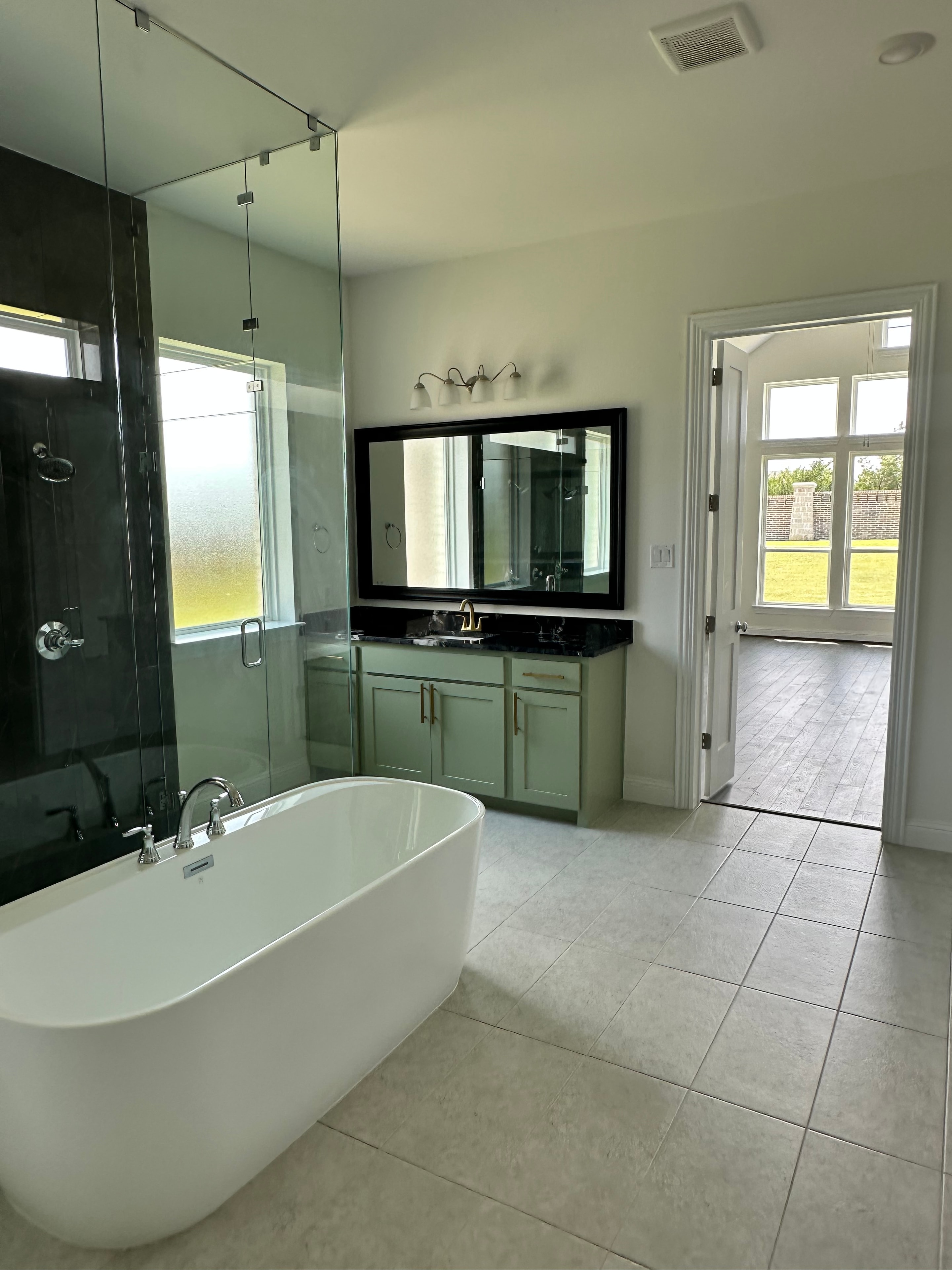 Plano Residence — guest bathroom with vessel sink and skylight